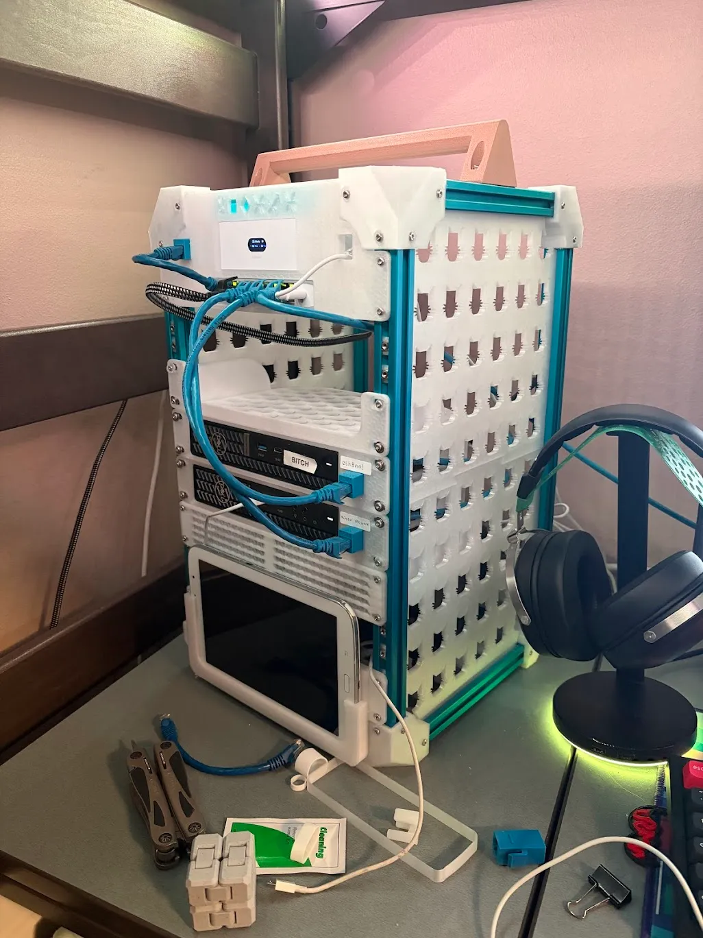 The mini rack with networking, computers, and storage